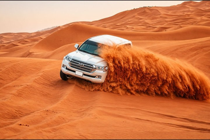 Dubai Desert Safari with Dune Bashing Camel Ride BBQ and Shows - Photo 1 of 13